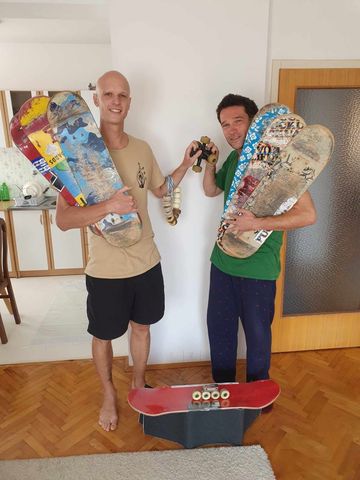 Martin and Mirzet posing with skate decks.